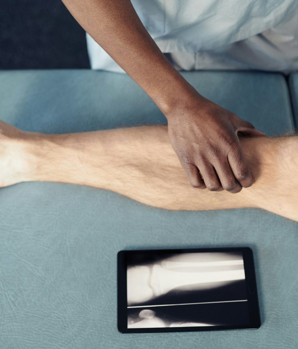 Therapist making medical massage to patient
